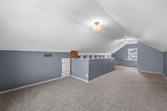 2500 D Ave NE, Cedar Rapids, IA 52402 - additional living space with vaulted ceiling and carpet flooring