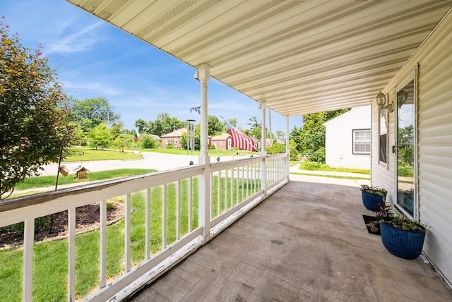3825 Hart Ct, Cedar Rapids, IA 52402 - covered porch with a yard and a residential view