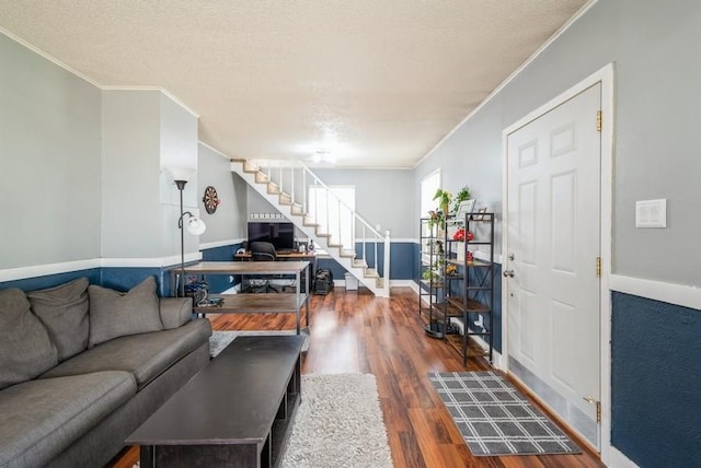 3825 Hart Ct, Cedar Rapids, IA 52402 - living room featuring stairway, ornamental molding, wood finished floors, and a textured ceiling