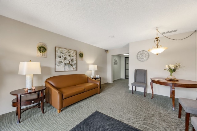 2131 1st Ave Unit 108, Cedar Rapids, IA 52402 - carpeted living area featuring a textured ceiling and baseboards