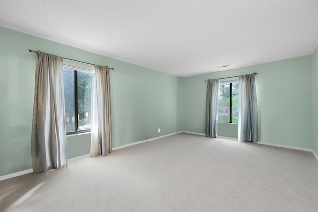 2131 1st Ave Unit 108, Cedar Rapids, IA 52402 - carpeted spare room featuring healthy amount of natural light