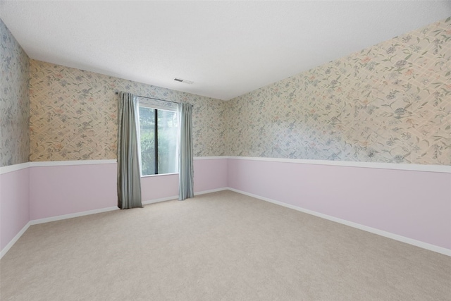 2131 1st Ave Unit 108, Cedar Rapids, IA 52402 - carpeted empty room featuring wallpapered walls