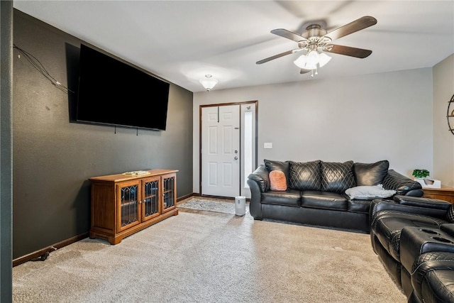2908 Riviera St SW Unit B, Cedar Rapids, IA 52404 - carpeted living room with baseboards and ceiling fan