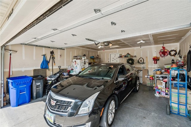 2908 Riviera St SW Unit B, Cedar Rapids, IA 52404 - garage featuring a garage door opener and freestanding refrigerator
