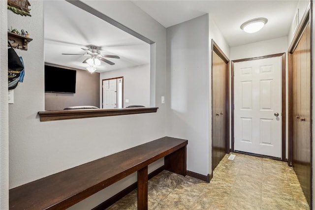 2908 Riviera St SW Unit B, Cedar Rapids, IA 52404 - entryway featuring a ceiling fan and baseboards