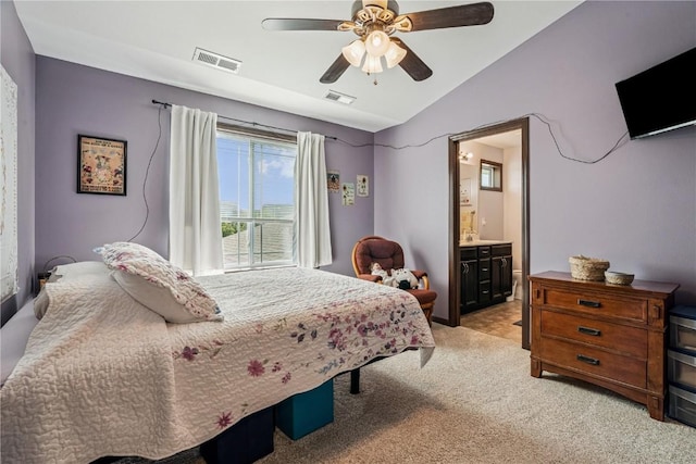 2908 Riviera St SW Unit B, Cedar Rapids, IA 52404 - bedroom with lofted ceiling, light colored carpet, ensuite bath, and ceiling fan