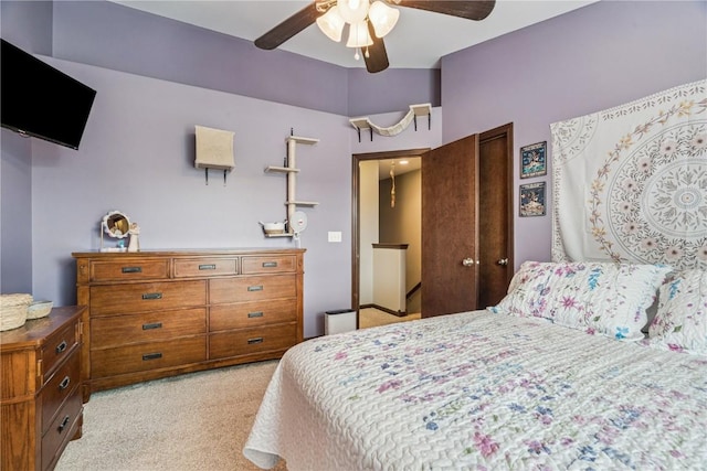 2908 Riviera St SW Unit B, Cedar Rapids, IA 52404 - bedroom with light carpet, ceiling fan, and a closet