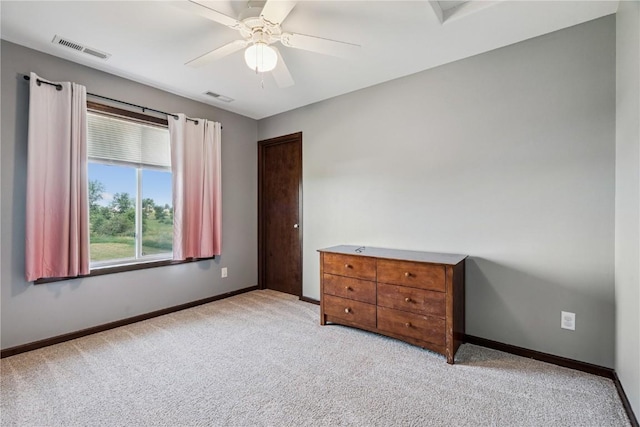 2908 Riviera St SW Unit B, Cedar Rapids, IA 52404 - bedroom featuring light carpet and ceiling fan