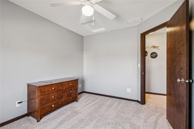 2908 Riviera St SW Unit B, Cedar Rapids, IA 52404 - bedroom with light colored carpet, a skylight, and ceiling fan