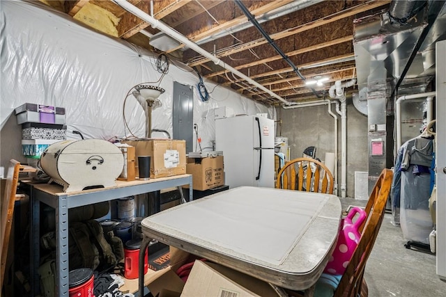 2908 Riviera St SW Unit B, Cedar Rapids, IA 52404 - unfinished basement featuring freestanding refrigerator and electric panel