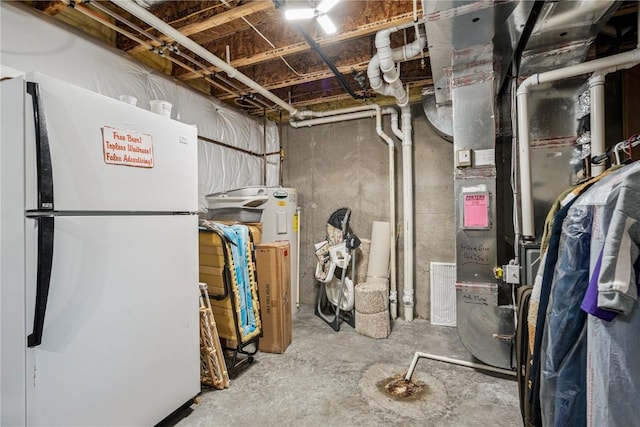 2908 Riviera St SW Unit B, Cedar Rapids, IA 52404 - unfinished basement featuring freestanding refrigerator and heating unit