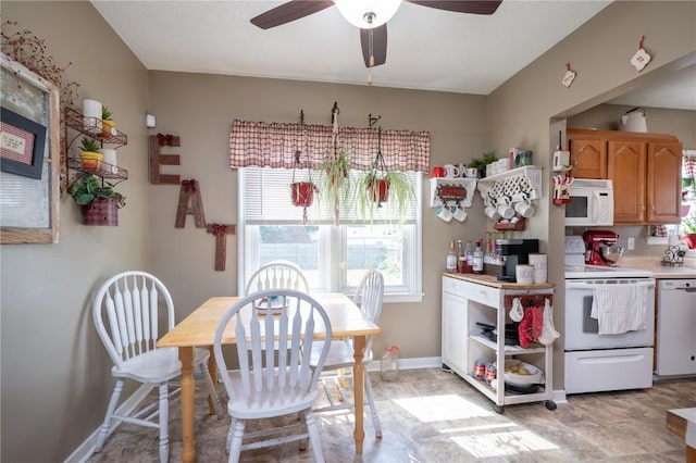 1305 E Ave, Vinton, IA 52349 - dining area with ceiling fan and baseboards
