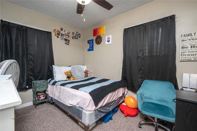 1305 E Ave, Vinton, IA 52349 - carpeted bedroom with a textured ceiling and a ceiling fan