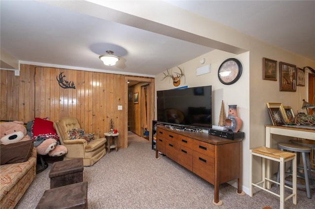 1305 E Ave, Vinton, IA 52349 - living room featuring light carpet and wooden walls