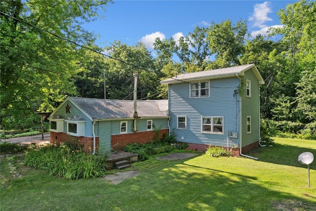 10205 Feather Ridge Rd, Toddville, IA 52341 - rear view of property with a yard