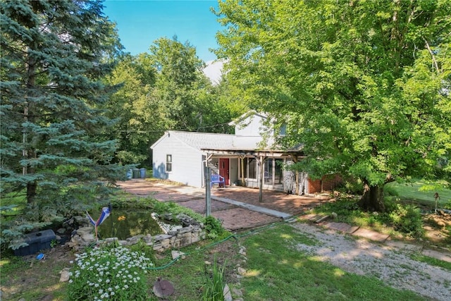 10205 Feather Ridge Rd, Toddville, IA 52341 - back of house with a patio area