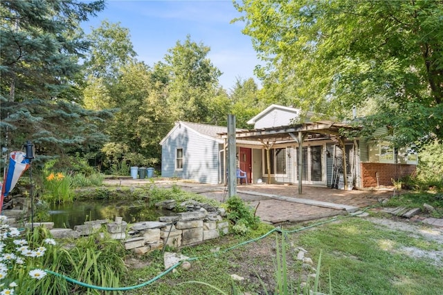 10205 Feather Ridge Rd, Toddville, IA 52341 - rear view of house with a patio