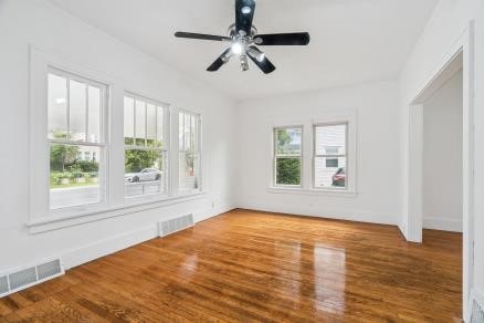 3107 E Ave NE, Cedar Rapids, IA 52402 - unfurnished room with wood finished floors and ceiling fan