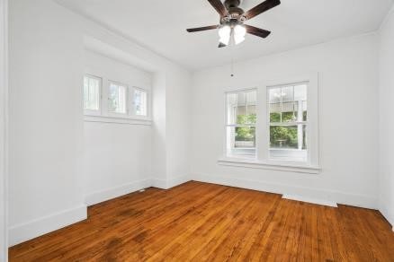 3107 E Ave NE, Cedar Rapids, IA 52402 - unfurnished room featuring ceiling fan and wood finished floors
