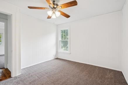 3107 E Ave NE, Cedar Rapids, IA 52402 - carpeted spare room featuring a ceiling fan and baseboards