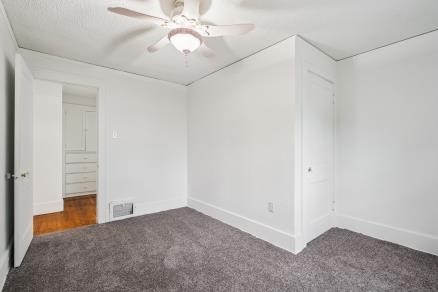 3107 E Ave NE, Cedar Rapids, IA 52402 - spare room with carpet flooring and ceiling fan