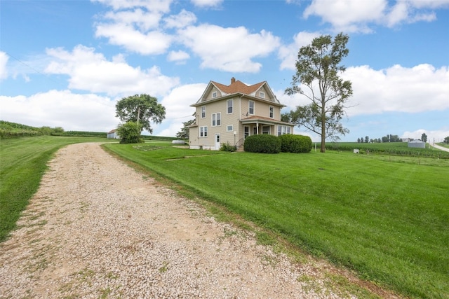 899 Jackson Ave, Mechanicsville, IA 52306 - view of side of home with a lawn, driveway, and a chimney