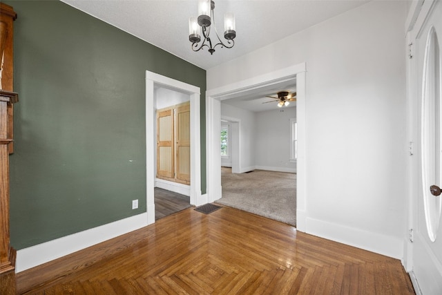 899 Jackson Ave, Mechanicsville, IA 52306 - unfurnished dining area with a ceiling fan and a chandelier