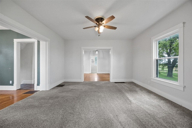 899 Jackson Ave, Mechanicsville, IA 52306 - empty room with carpet flooring and a ceiling fan