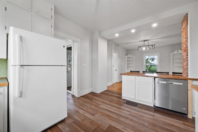 899 Jackson Ave, Mechanicsville, IA 52306 - kitchen featuring freestanding refrigerator, dishwasher, butcher block countertops, recessed lighting, and white cabinets