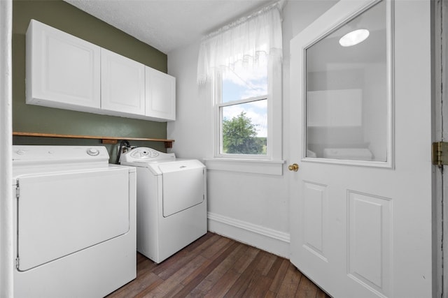 899 Jackson Ave, Mechanicsville, IA 52306 - laundry area with cabinet space, washing machine and clothes dryer, and dark wood finished floors