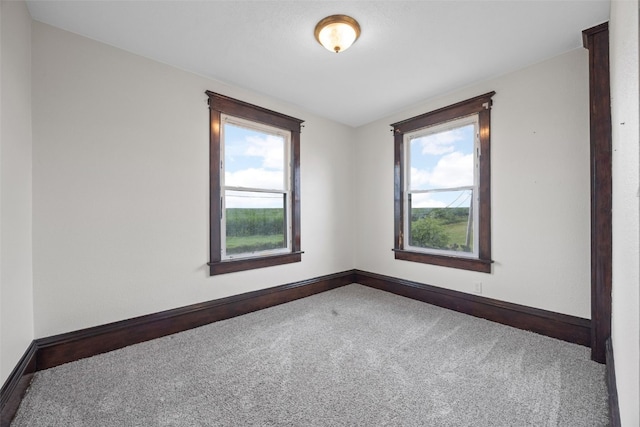 899 Jackson Ave, Mechanicsville, IA 52306 - carpeted empty room featuring healthy amount of natural light