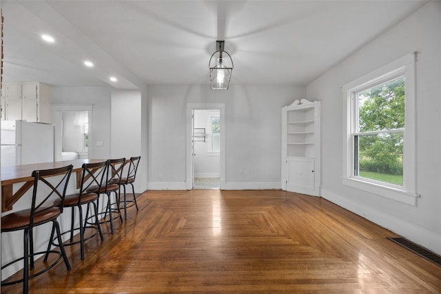 899 Jackson Ave, Mechanicsville, IA 52306 - unfurnished dining area featuring healthy amount of natural light and recessed lighting