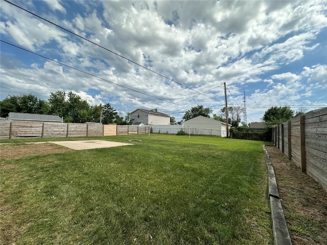 1125 W 10th Ave, Marion, IA 52302 - fenced backyard with a patio area