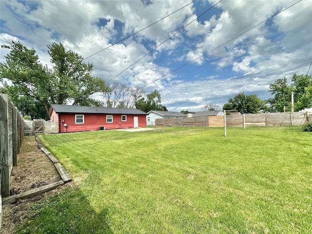 1125 W 10th Ave, Marion, IA 52302 - fenced backyard with a patio area
