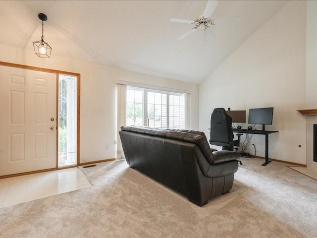 935 74th St NE Unit 5, Cedar Rapids, IA 52402 - foyer entrance with light carpet, plenty of natural light, high vaulted ceiling, and ceiling fan