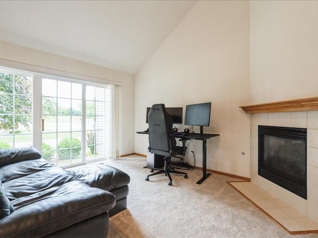 935 74th St NE Unit 5, Cedar Rapids, IA 52402 - home office featuring carpet, healthy amount of natural light, a fireplace, and high vaulted ceiling
