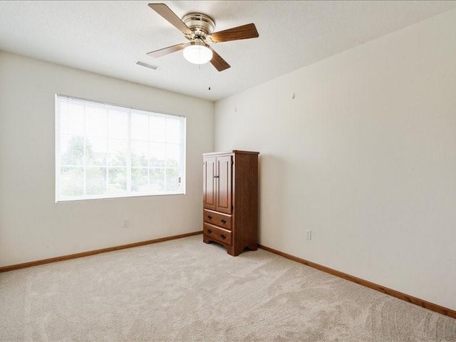 935 74th St NE Unit 5, Cedar Rapids, IA 52402 - spare room with light carpet and ceiling fan