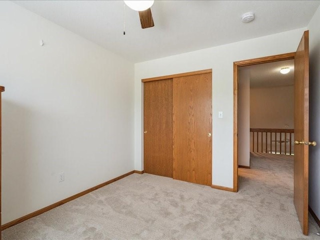 935 74th St NE Unit 5, Cedar Rapids, IA 52402 - unfurnished bedroom with carpet flooring, a closet, and ceiling fan