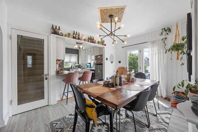 2518 1st Ave NE, Cedar Rapids, IA 52402 - dining area featuring a chandelier, light wood finished floors, and french doors