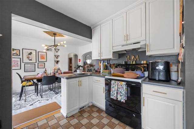 2518 1st Ave NE, Cedar Rapids, IA 52402 - kitchen featuring black electric range, under cabinet range hood, arched walkways, a peninsula, and white cabinets