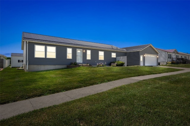 204 Northgate St, Shellsburg, IA 52332 - ranch-style home featuring a metal roof, a front yard, and a garage