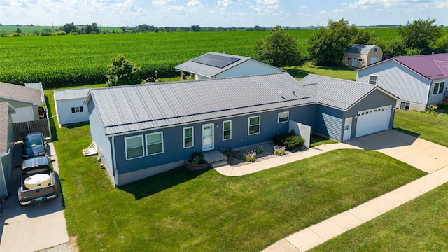 204 Northgate St, Shellsburg, IA 52332 - ranch-style house featuring driveway, a front yard, a rural view, and a metal roof