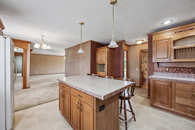204 Northgate St, Shellsburg, IA 52332 - kitchen featuring freestanding refrigerator, a kitchen bar, a center island, open floor plan, and open shelves