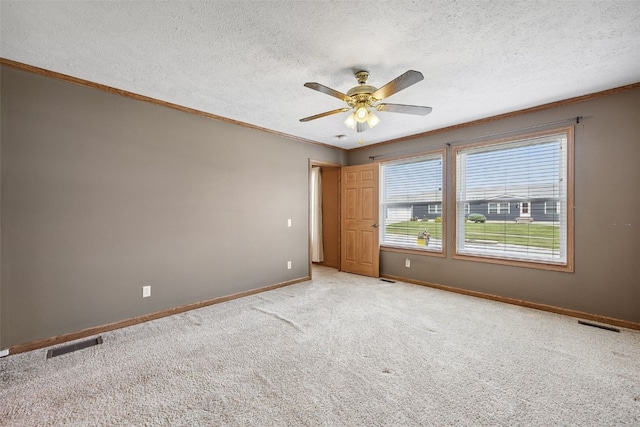 204 Northgate St, Shellsburg, IA 52332 - spare room with ornamental molding, light carpet, a ceiling fan, and a textured ceiling