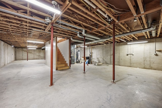 204 Northgate St, Shellsburg, IA 52332 - unfinished below grade area featuring gas water heater and stairs