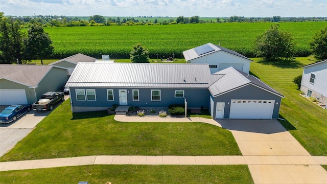 204 Northgate St, Shellsburg, IA 52332 - ranch-style house featuring concrete driveway, a view of rural / pastoral area, a front lawn, agricultural plots, and a metal roof