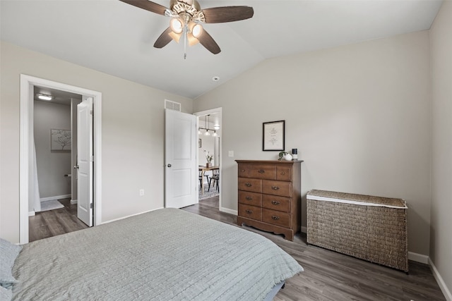 904 Hughes St, Coralville, IA 52241 - bedroom with wood finished floors, vaulted ceiling, and a ceiling fan