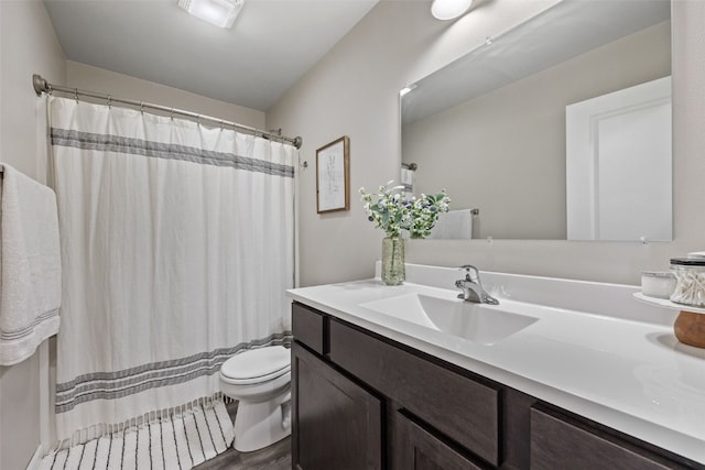 904 Hughes St, Coralville, IA 52241 - bathroom with vanity, a shower with curtain, and wood finished floors