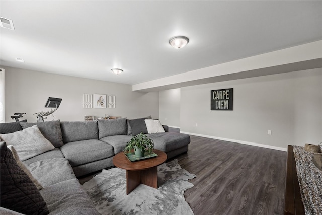 904 Hughes St, Coralville, IA 52241 - living room featuring dark wood-style floors and baseboards