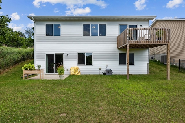 904 Hughes St, Coralville, IA 52241 - back of house featuring a lawn and a deck